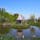 旭川にある上野ファームはほんとに絵本みたいな景色が広がるスポット。

写真は池の真ん中に建てられたノーム（妖精）の家で、こじんまりとしたようすがとってもかわいいのですが、残念ながら人間は入れませんでした。
