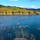 湛水面積国内2位、貯水量国内4位のシューパロ湖は、炭鉱で栄えた頃には2万人が暮らしていた鹿島地区が眠る巨大なダム湖です。紅葉の名所としても知られ、立ち枯れた木々やアーチ橋がかつての繁栄を感じさせるノスタルジックな風景が楽しめます！#北海道 #夕張 #シューパロ湖